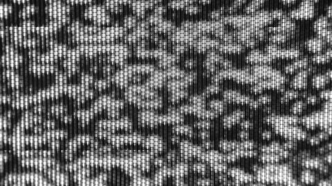 TV noise. CRT picture tube of an old retro TV. Close-up view, macro. Black and white TV pixels. There is no signal. Abstract background.