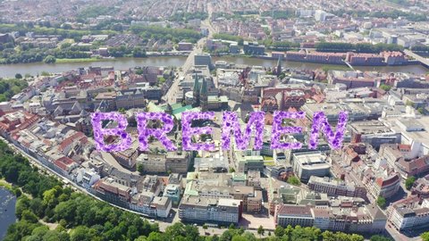 Inscription on video. Bremen, Germany. The historic part of Bremen, the old town. Bremen Cathedral ( St. Petri Dom Bremen ). View in flight. Shimmers in colors purple, Aerial View, Departure of the c