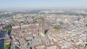 Inscription on video. Strasbourg, France. The historical part of the city, Strasbourg Cathedral. Arises from blue water, Aerial View