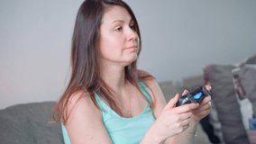 Passionate about the game. A woman plays video games in her spare time.