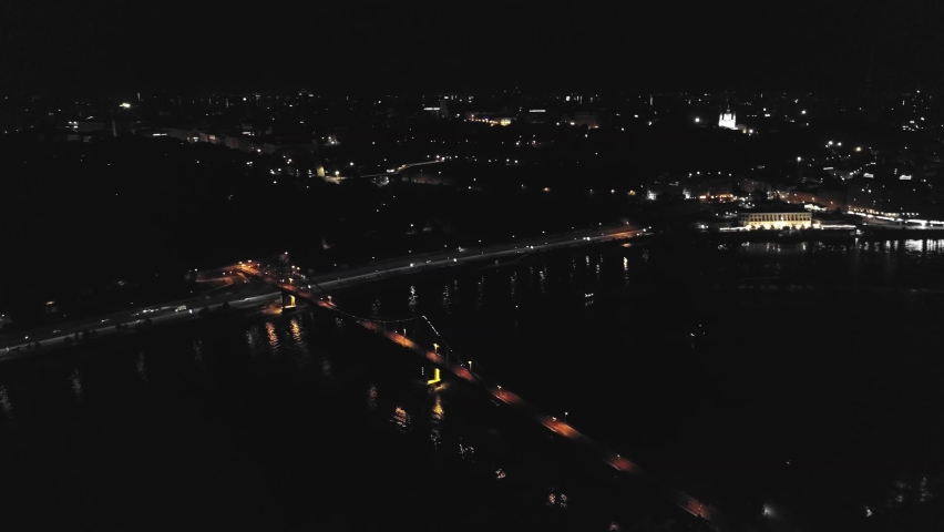 Aerial drone footage of night Kyiv. Walking bridge at night