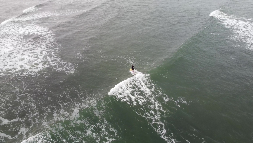 Surfer in the Atlantic Ocean off the coast of Africa