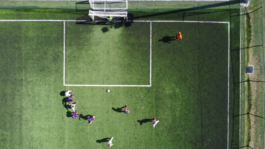 Top view of children's soccer team training outdoors. | Shutterstock HD Video #1086230855