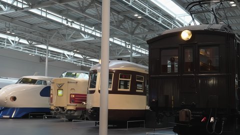 Nagoya.Japan-October 31.2019: Old and new locomotives displayed in a train museum in Nagoya Japan. Evolution of design and technology. Camera slowly turning left.