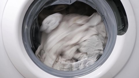 Washing clothes in a washing machine. 