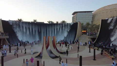 Dubai, UAE - November 28, 2021: Water feature at Expo 2020 in Dubai, tourists enjoying majestic waterfall