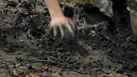 Hands In A Mud During Extreme Race