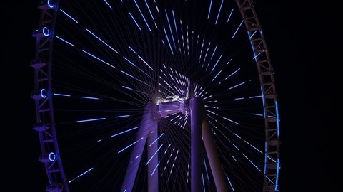 Dubai , United Arab Emirates - 01 11 2022: Close up of Ain Dubai light show at night, Observation wheel in blue water island