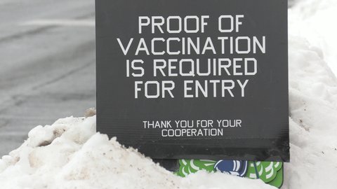 Markham, Ontario, Canada January 2022 Vaccine mandate warning sign for mandatory COVID 19 omicron vaccination at restaurants in Toronto