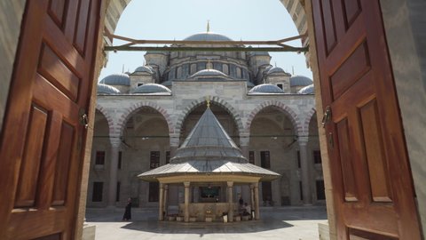 Istanbul, Turkey - September 16, 2021: Entrance to the Fatih Mosque in Istanbul, Turkey. The Ottoman imperial mosque is a popular destination among tourists and pilgrims in the world.