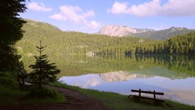Spectacular view of the water surface of Black Lake. Location place National park Durmitor, Zabljak, Montenegro, Balkans, Europe. Cinematic shot. Filmed in UHD 4k video. Discover the beauty of earth.