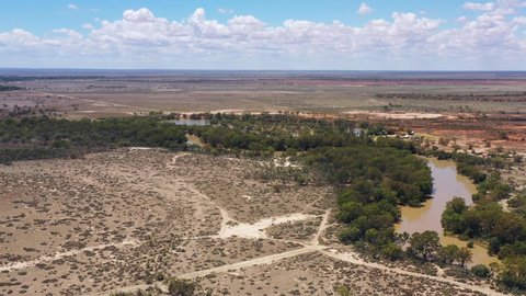 Darling river watercourse around Wilcannia town in outback Australia aerial 4k.
