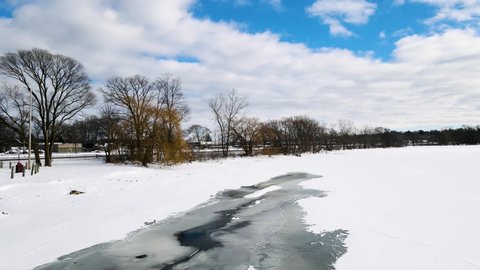 Tracking across the shoreline of Mona Lake in winter.