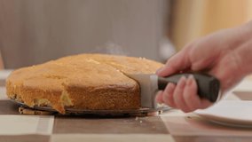caucasian woman hands slicing apple pie with big knife and removing hot piece with steam in slow motion - Powered by Shutterstock - Get 15% off with code: PIKWIZARD15