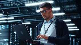 Successful Data Center IT Specialist Using Laptop Computer. Server Farm Cloud Computing Facility with System Administrator Working. Data Protection Engineering Network for Cyber Security. - Powered by Shutterstock - Get 15% off with code: PIKWIZARD15