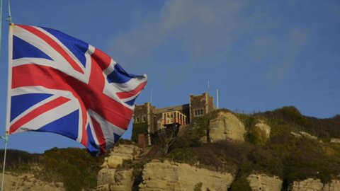 HASTINGS, UK - FEBRUARY 01, 2022: Union Jack flies in front of East Hill Lift in Hastings, UK.