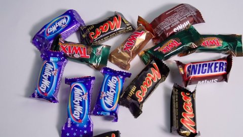 Tyumen, Russia-January 23, 2022: Assortment candy bars mini flat lay from Mars Chocolate close up. Slow motion