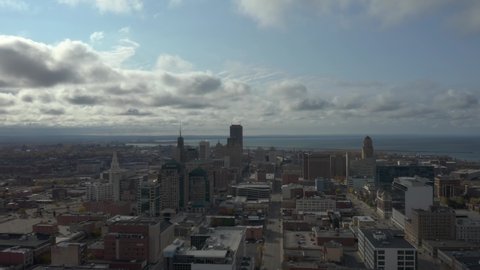 Aerial pullback establishing shot of Buffalo NY skyline and Lake Erie
