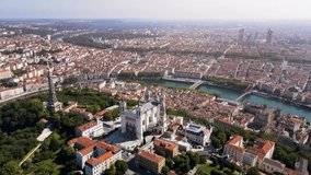 Lyon panorama with Fourviere basilica, Part-Dieu city center Rhone and Saone rivers, France. Aerial footage of famous touristic landmarks, French city of lights. Sunny warm summer day, blue sky.