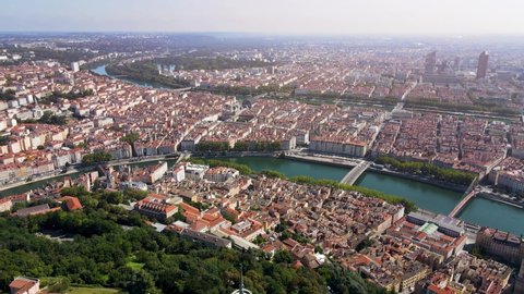 Lyon panorama from Fourviere hill, old town, presqu'ile peninsula, Part-Dieu city center, Rhone and Saone rivers, France. Aerial footage of famous touristic landmarks. Sunny warm summer day, blue sky