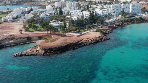 Hotels on the coastline of Protaras, Cyprus. Aerial view. Beach resort in sunny summertime.