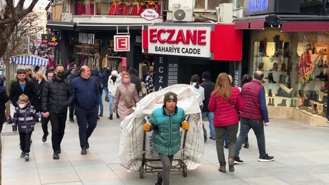 Istanbul, Turkey - January 30, 2022: A waste material collector pulls his cart in Kadikoy district, Asian side of Istanbul city, amid a severe economic crisis in the country.