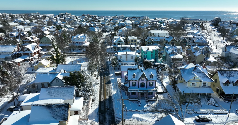 Historic charming Victorian architecture in oceanside resort town, Cape May New Jersey, USA. Fresh winter snow.