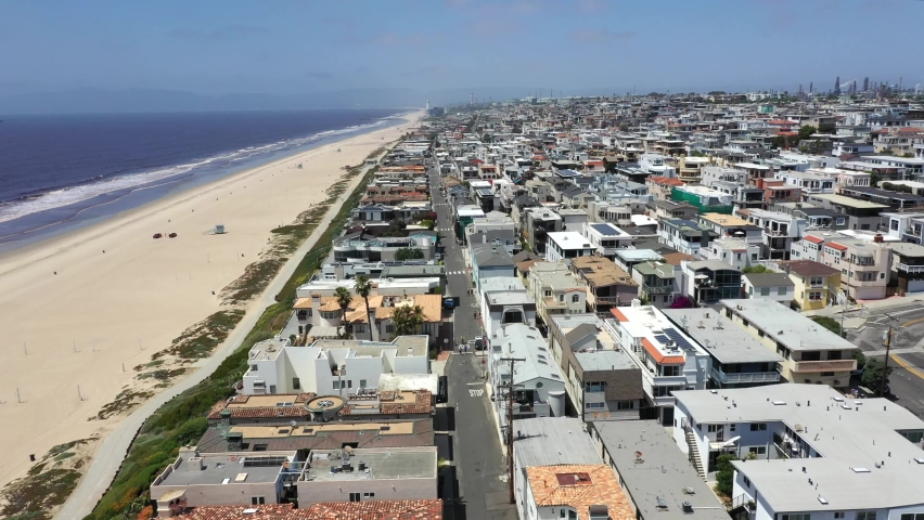 Aerial View Of Manhattan Beach Waterfront City With Empty Beach During COVID-19 Pandemic. Royalty-Free Stock Footage #1086307622