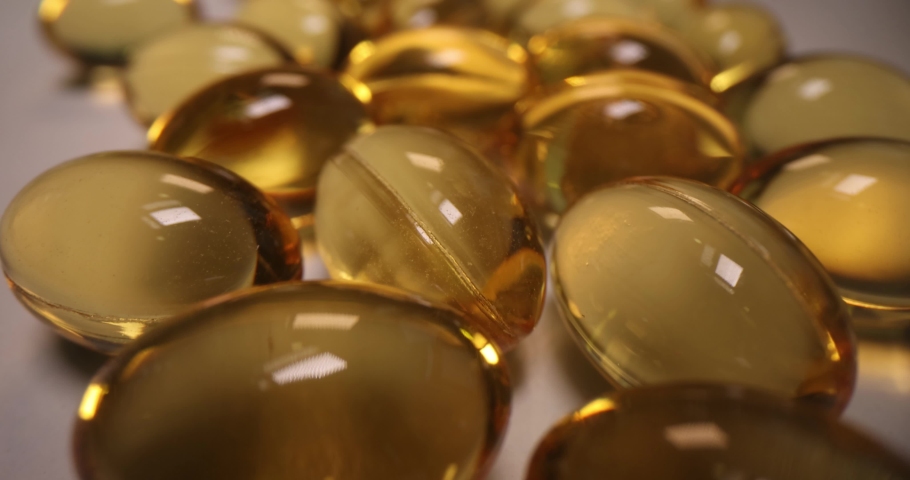 Transparent capsules with omega 3 fatty acids closeup