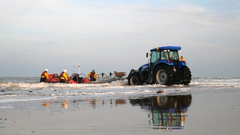 Cromer, Norfolk, United Kingdom. Circa May 2021. Cromer RNLI D-Class Inshore Lifeboat being recovered on beach for training exercise.