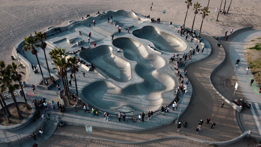 Aerial view of the Venice Beach Skate Park in Los Angeles, California. The most popular skate park in the world. People are skating and rollerblading on the beach.