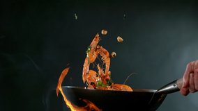 Super slow motion of flying whole prawns from wok pan. Filmed on high speed cinema camera, 1000 fps. - Powered by Shutterstock - Get 15% off with code: PIKWIZARD15