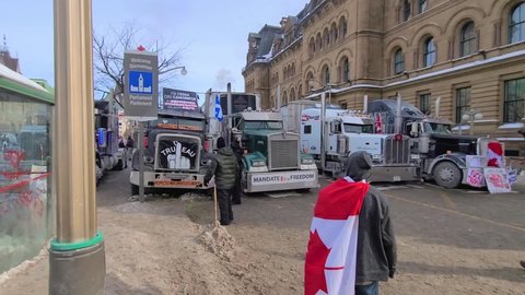 Freedom convoy 2022 in downtown Ottawa, Convoy of freedom. Canadian convoy protest against COVID-19 vaccine. No vaccine mandates Ottawa Ontario, Canada - February 1, 2022