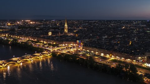 Basilica of St. Michael, Establishing Aerial View Shot of Bordeaux Fr, world capital of wine, Nouvelle-Aquitaine, France at night evening