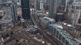Overcast and Hazy, Train approaches Elephant and Castle, Establishing Aerial View Shot of London UK, United Kingdom