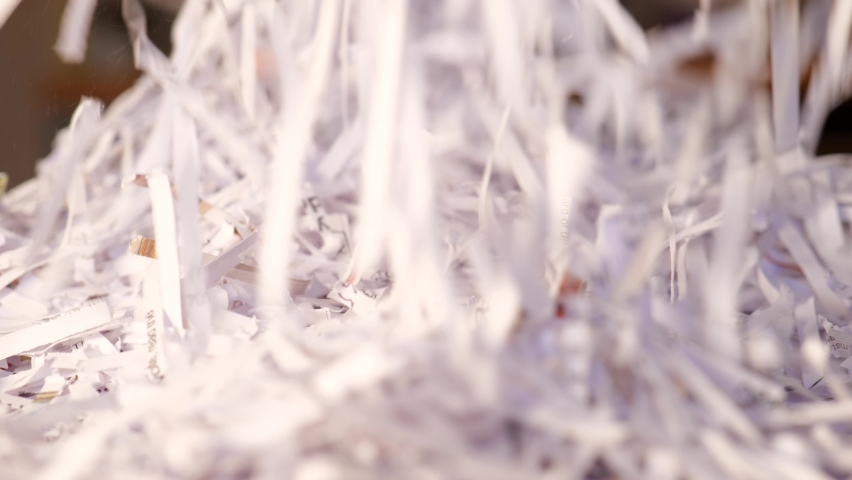 Shredded paper documents falling into a pile background Royalty-Free Stock Footage #1086334748