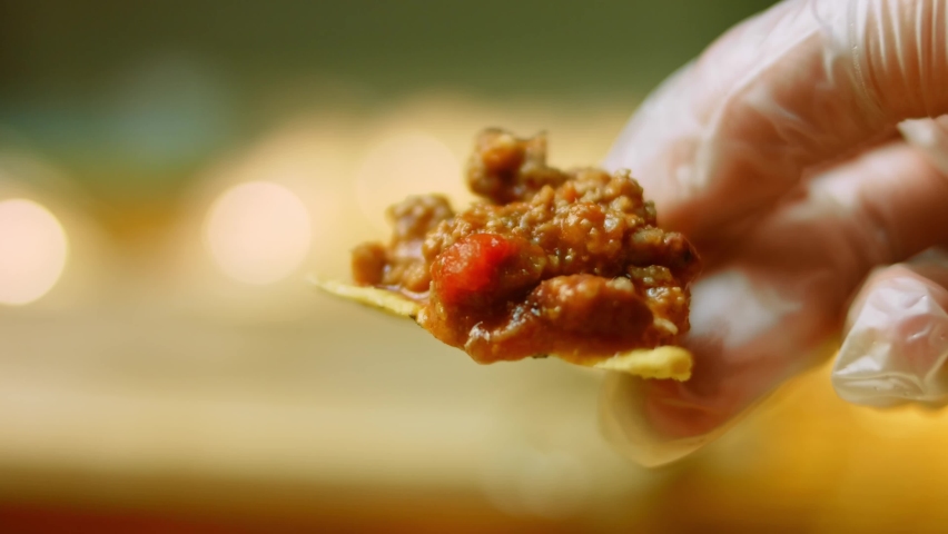 Chili con carnet with nachos. Made from turkey with Belgian beer. Macro shooting