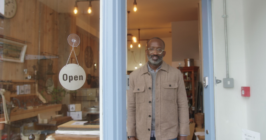 Portrait of Black Male Small Business Store Owner Looking at Camera Smiling Royalty-Free Stock Footage #1086335696