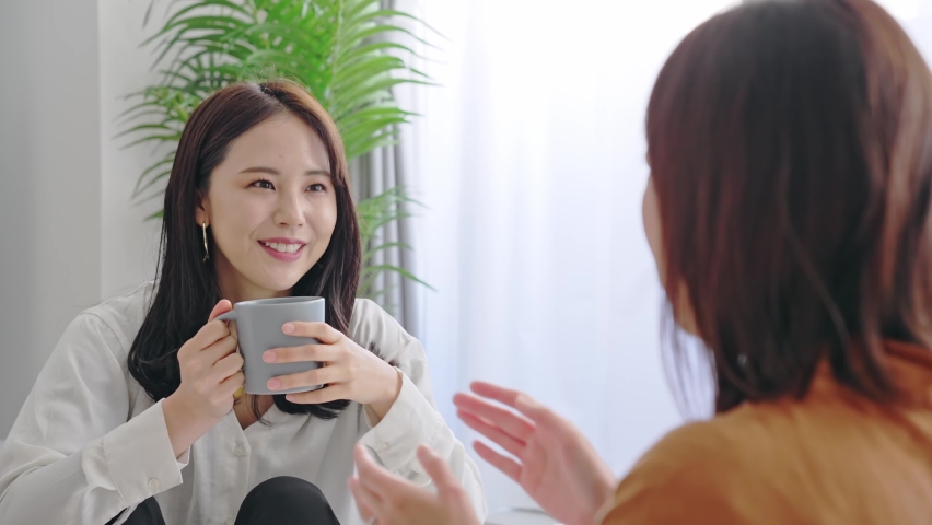 Young Asian women talking in room. | Shutterstock HD Video #1086345182