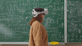 Portrait of young female student wearing virtual reality headset in school classroom - Powered by Shutterstock - Get 15% off with code: PIKWIZARD15