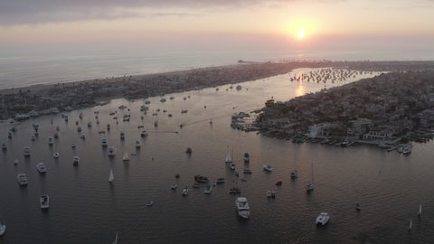 Aerial Panning Above A Busy Marina Full Of Boats At Sunset - Newport Beach, California