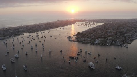 Aerial Panning High Above A Busy Marina Full Of Boats At Sunset - Newport Beach, California