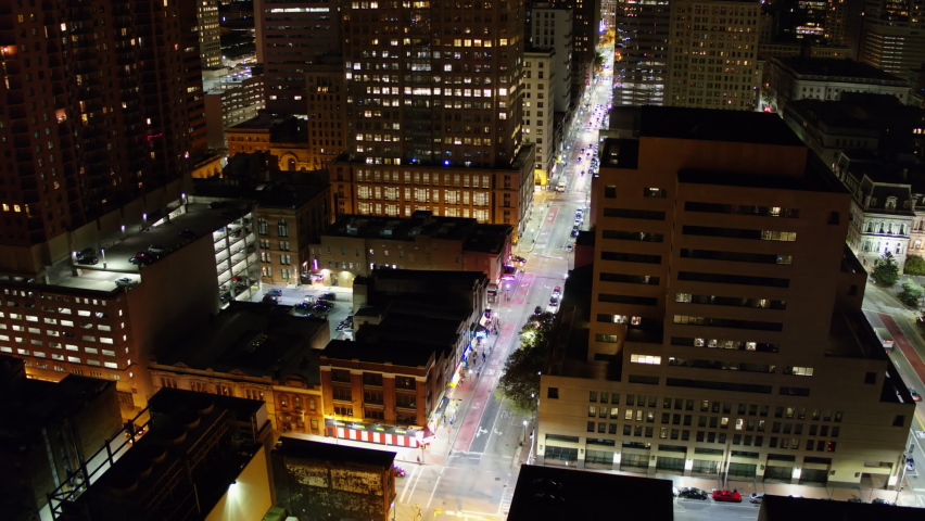 Aerial Forward Shot Of Cars Moving On Road Amidst Buildings In Illuminated City - Baltimore, Maryland