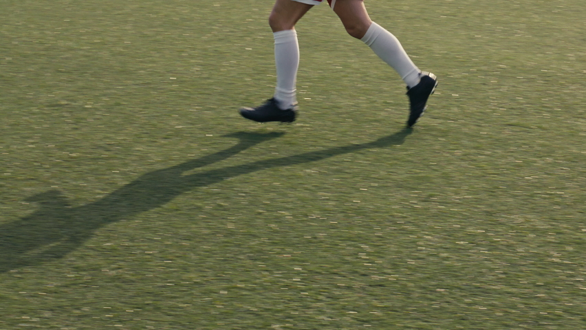 Close up of a soccer player receiving a pass and shooting the ball towards the goal on a soccer field. Soccer players are wearing unbranded sports clothes. 4k slow motion video. | Shutterstock HD Video #1086353141