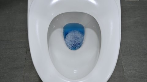 Flushing down with cleaner water in toilet bowl