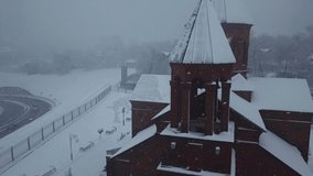 Aerial photography of the Armenian church in winter in a heavy snowstorm