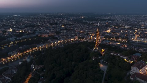 Push near Metallic Tower of Fourviere, Establishing Aerial View Shot of Lyon Fr, Auvergne-Rhone-Alpes, France at night evening