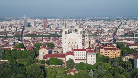 Lyon, France - circa 2021 - Basilica of Notre-Dame de Fourviere, circling righ, broad daylight, Establishing Aerial View Shot of Lyon Fr, Auvergne-Rhone-Alpes, France