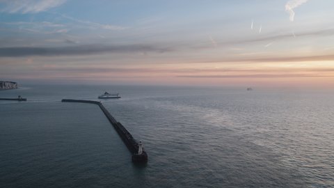 Dover, Great Britain - circa 2021 - Entrance to the Port of Dover, one ferry arrive, one ferry leave, Establishing Aerial View Shot of Dover UK, Kent, England, United Kingdom