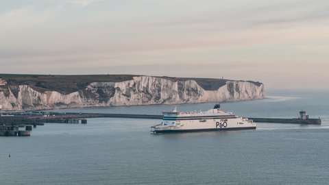 Dover, Great Britain - circa 2021 - Ferry arrives to Port of Dover, East Dock, long lens, Establishing Aerial View Shot of Dover UK, Kent, England, United Kingdom